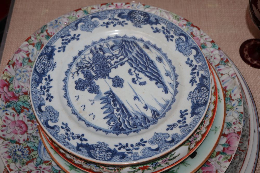 A collection of Oriental chargers and plates,